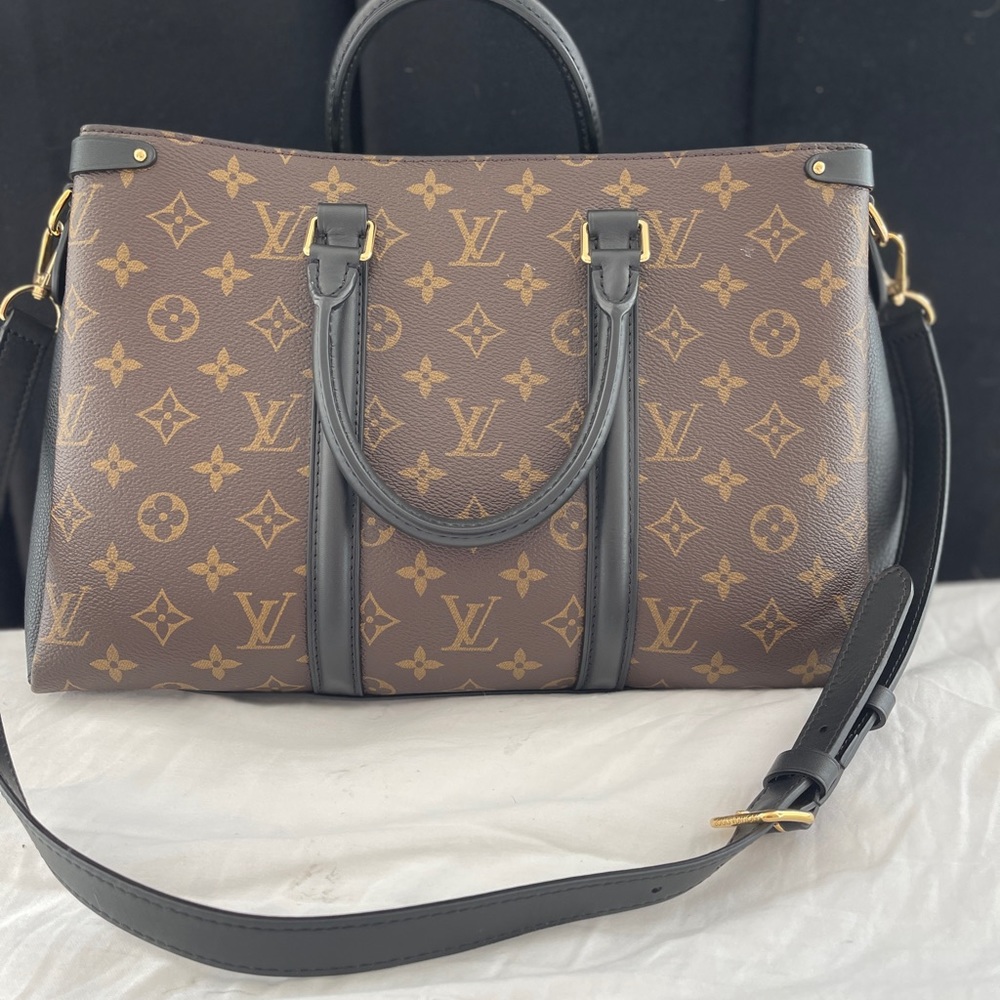 Louis Vuitton shoulder bag( received as gift). Used once, black suede interior.